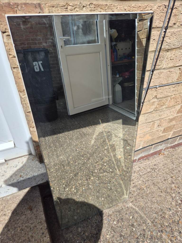 Bevelled mirror from dressing table - approximate 92cm x 41cm - but does have crack in the corner