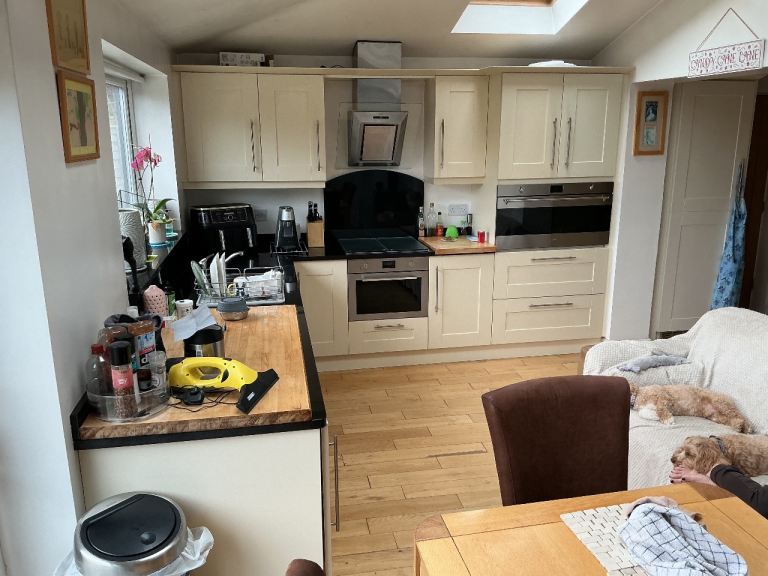 Kitchen shaker style cream ivory colour with black granite worktop