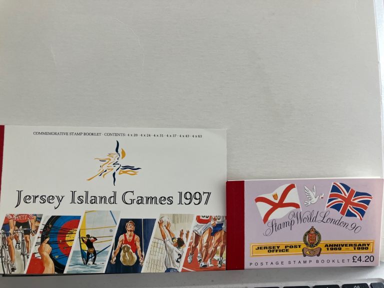2 Jersey stamp booklets: Island Games and Post Office Anniversary