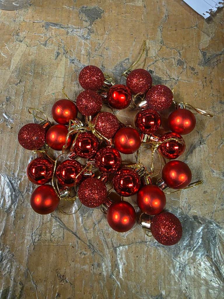 A new still packed pack of 24Pcs small Christmas Baubles Red. 