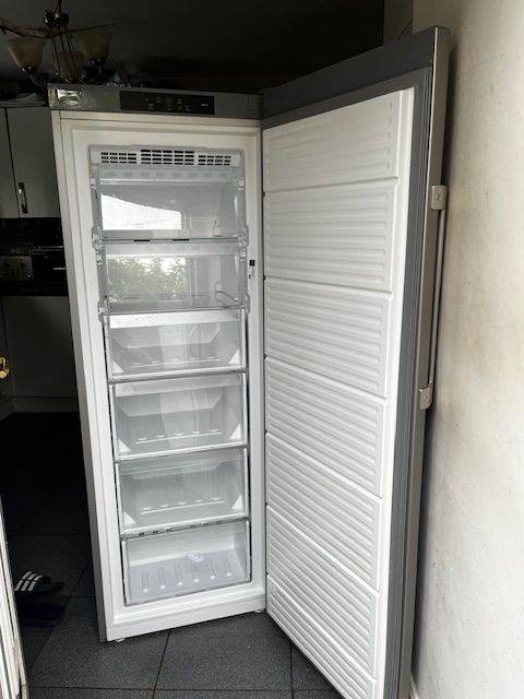 GREY FROST FREE HOTPOINT UPRIGHT FREEZER IN GOOD WORKING CONDITION.
