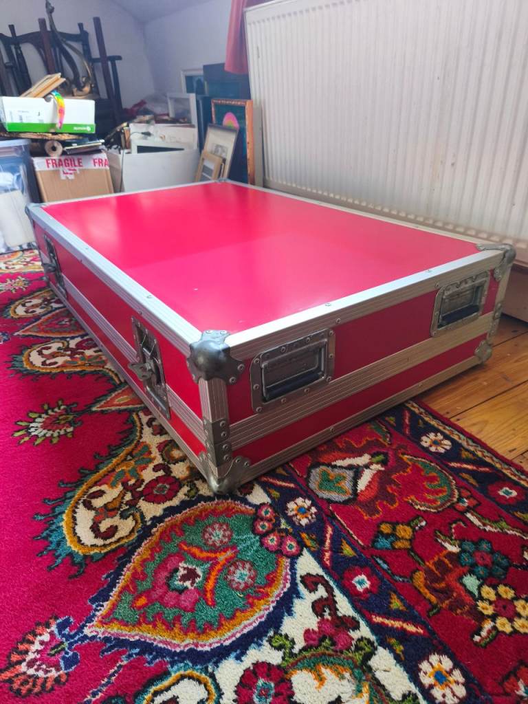 Large red flight case can be a great coffee table!