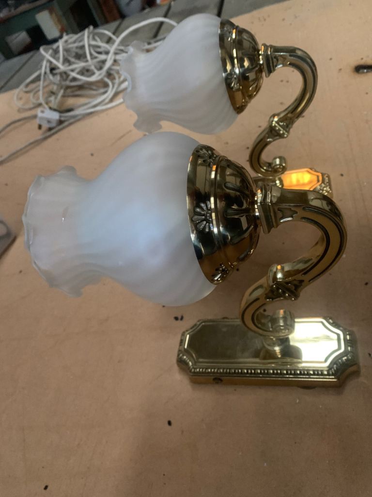 Two heavy weight brass wall lights. 