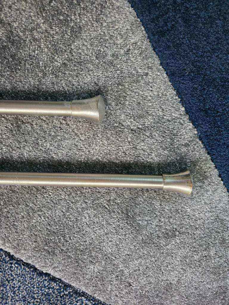 Pair of extendable 120-210cm metal eyelet curtain poles with rod finals