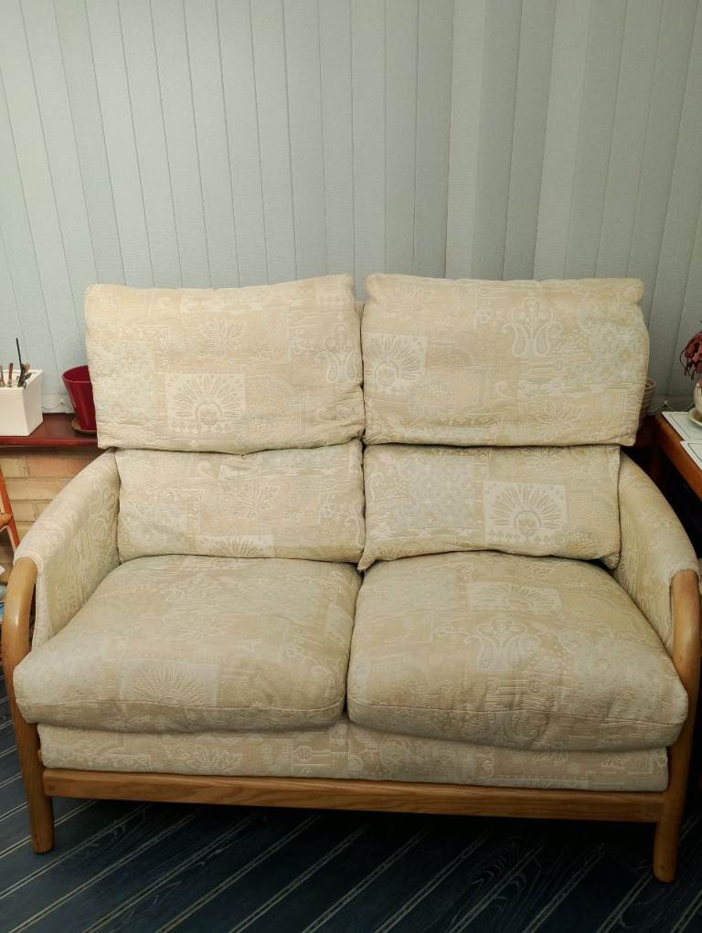 Two seater " Cintique" sofa. Wooden frame. Light green and beige upholstery. Excellent condition 