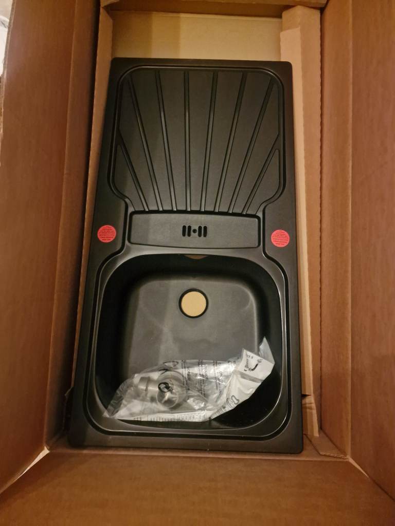 Small compact black sink