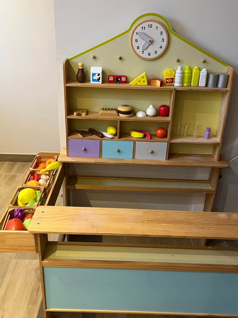 image for Wooden play shop with accessories for children.