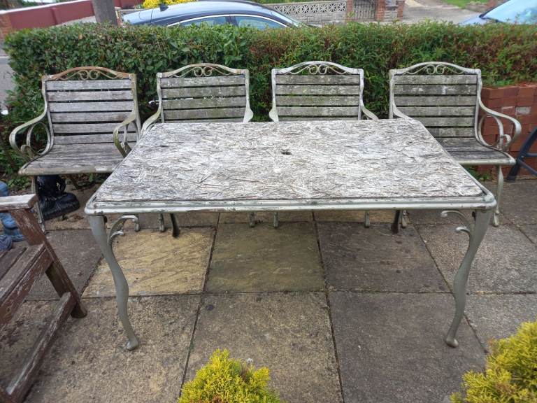 4 Cast iron chairs very solid and heavy with cast iron table