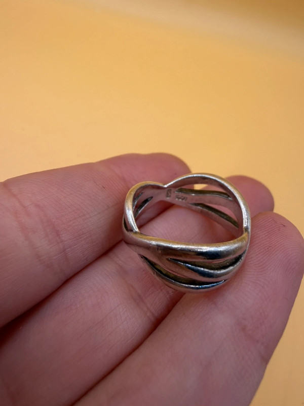 sterling silver wave ring features a distinctive intertwined design Uk ...