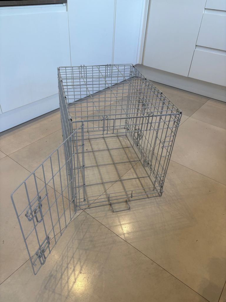 Metal dog crate with black cover