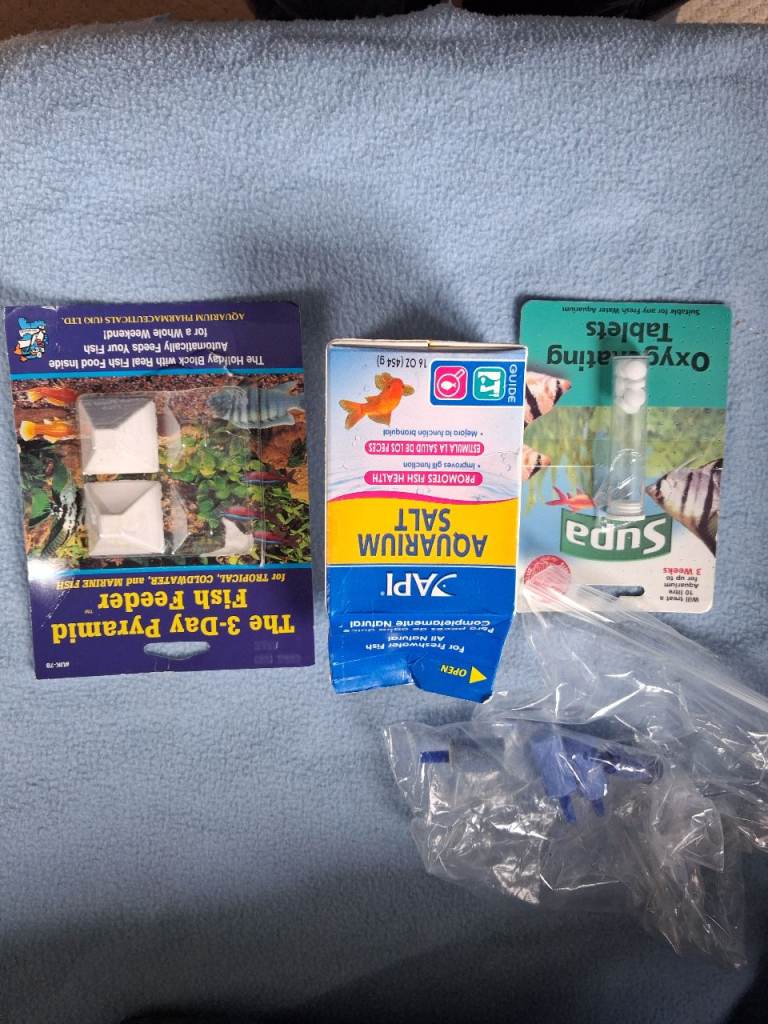 Aquarium accessories including air stones, food and salt