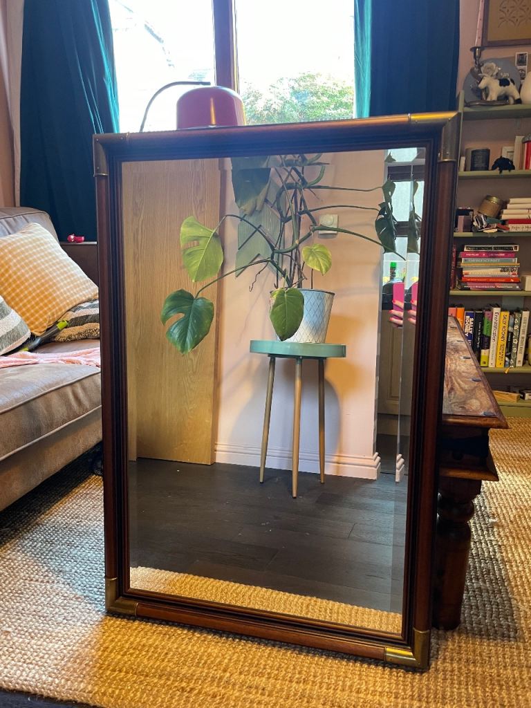 Large wall mirror dark brown with brass-effect corners