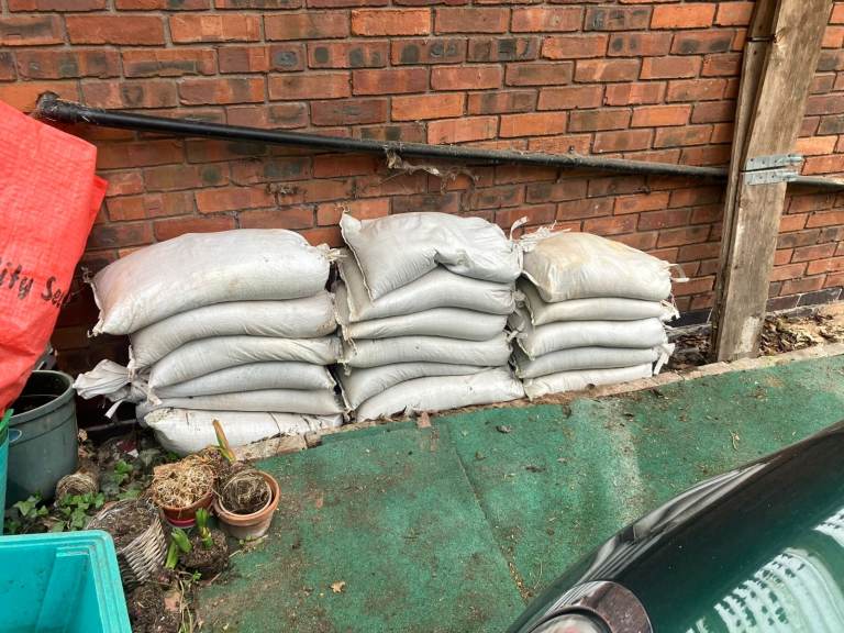 17 filled sand bags in polypropylene bags