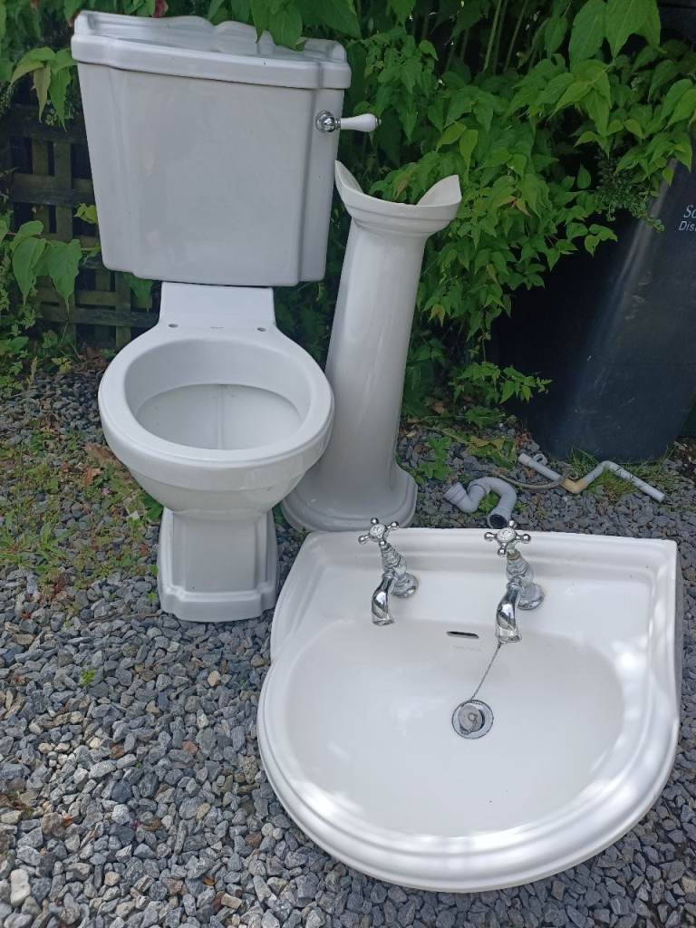 Pedestal basin with toilet and cistern 