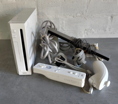 Nintendo Wii Console with Controller, Nunchuck & Sensor Bar and includes some games