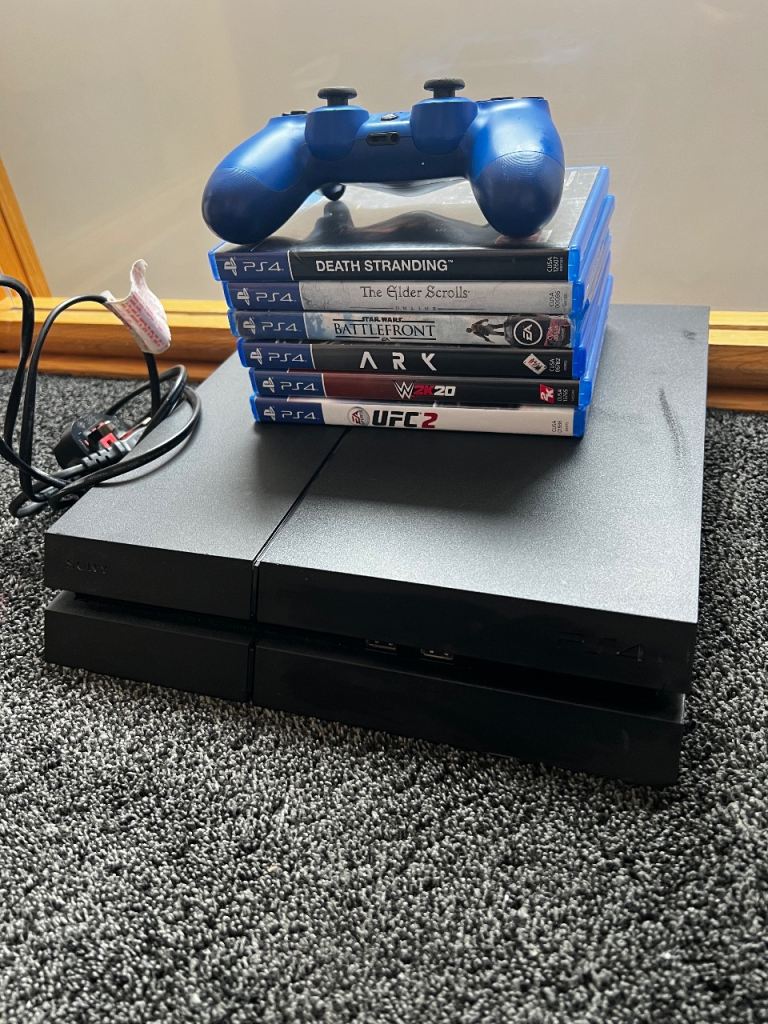 PS4 Console with Blue Controller & 6 Games – Good Condition
