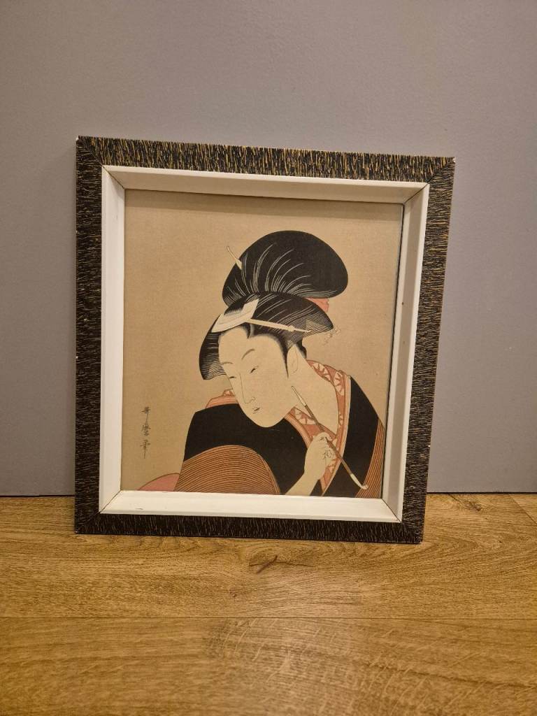 Framed Ukiyo-e woodblock print by the famous Japanese artist Kitagawa Utamaro. 