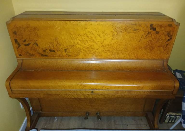 Upright art deco style piano