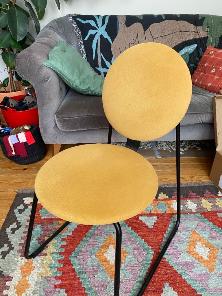 3 Retro chairs: 2 Yellow Ikea Chairs and 1 Eames Black/Transparent Metal Chair