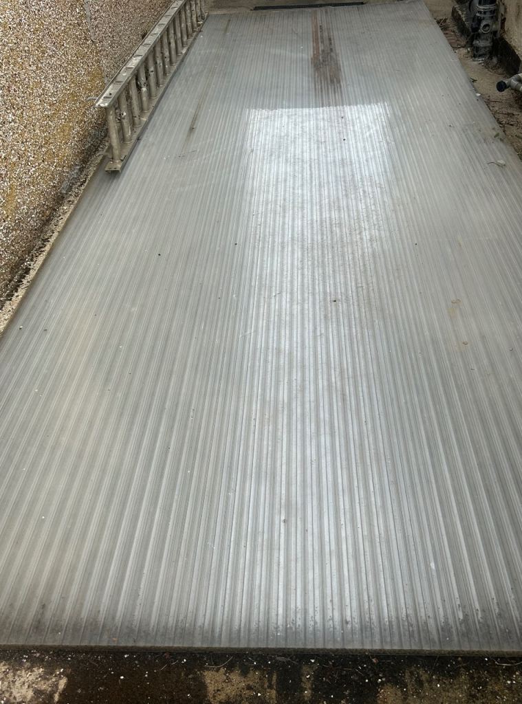 Corrugated plastic roofing sheet