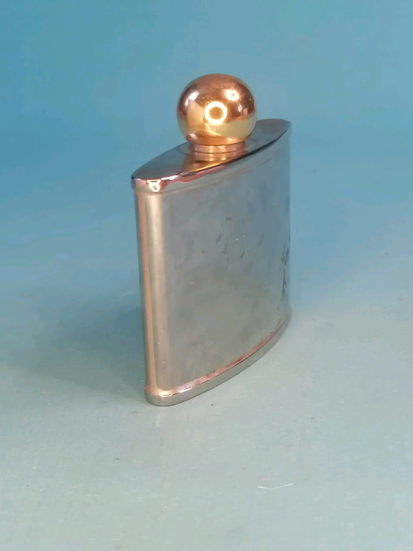 Hip-flask 3-inch stainless steel 2-0z.(Good condition). Brass top..