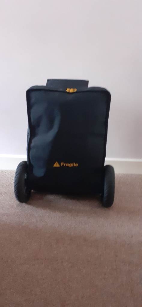 E-FOLDI LITE TRAVEL SCOOTER WITH TRAVEL/STORAGE COVER, CHARGER AND USER MANUAL