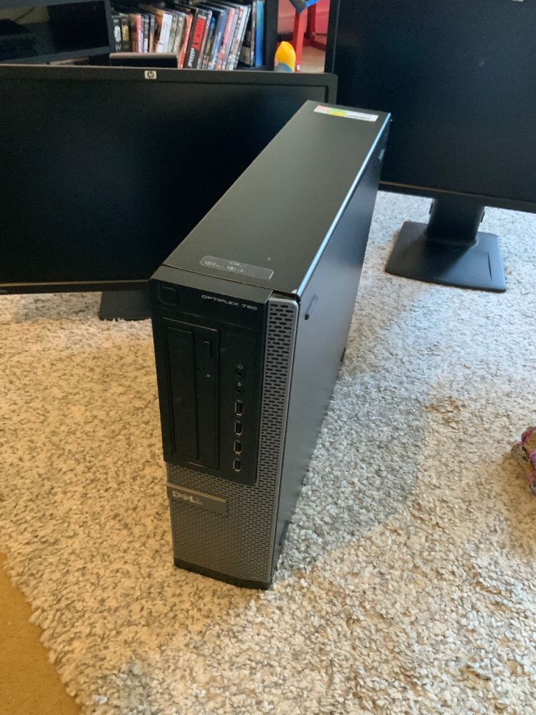 Dell Computer and two HP screens