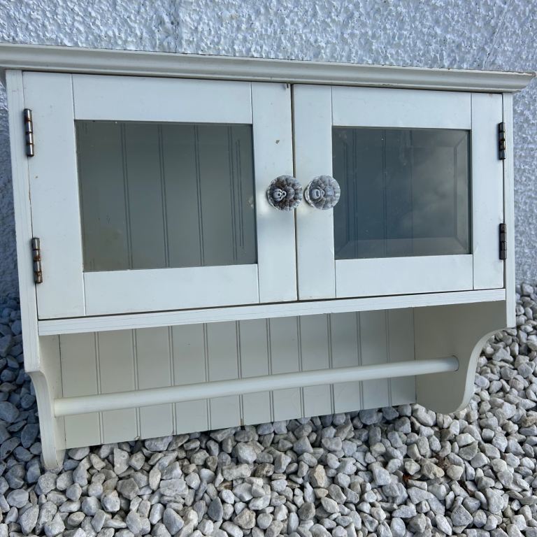 Vintage wooden cabinet with glass doors and towel rail cream 