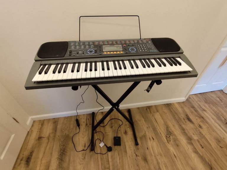 Casio keyboard with power supply and stand