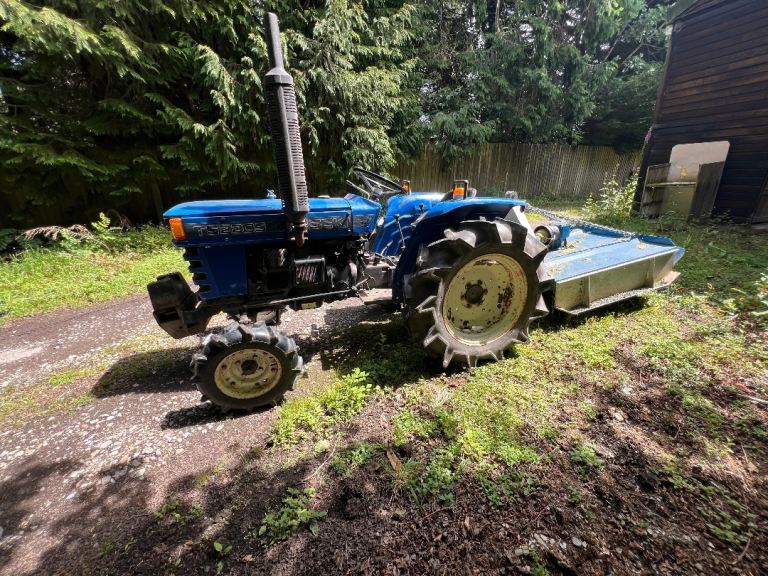 Compact tractor and topper