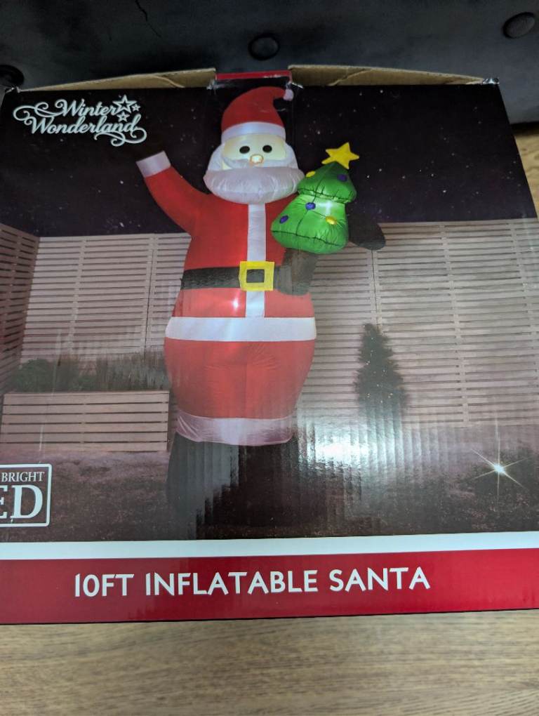 Huge 10ft inflatable Santa holding a Christmas tree. New in box