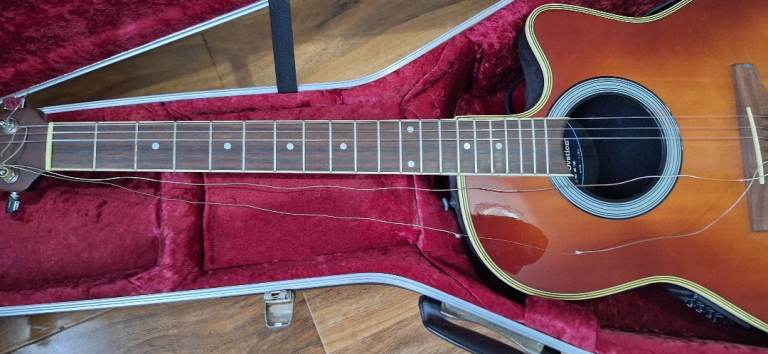 Electric/acoustic guitar, model AE138. Approx 20 years old. with hard case