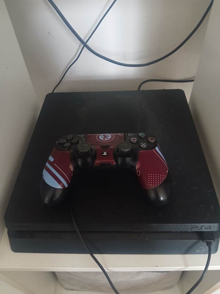 Sony PlayStation 4 Slim Console with Controller and 4 Games