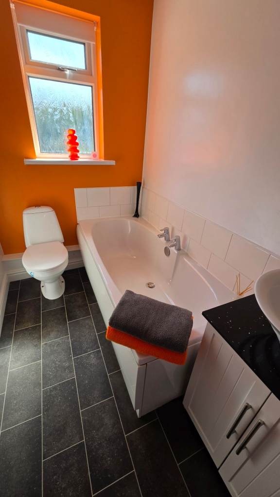 White Bath with Two Chrome Taps – Good Condition