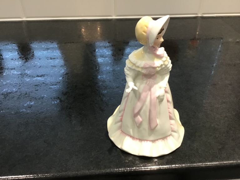 Pretty porcelain figurine 7” high 