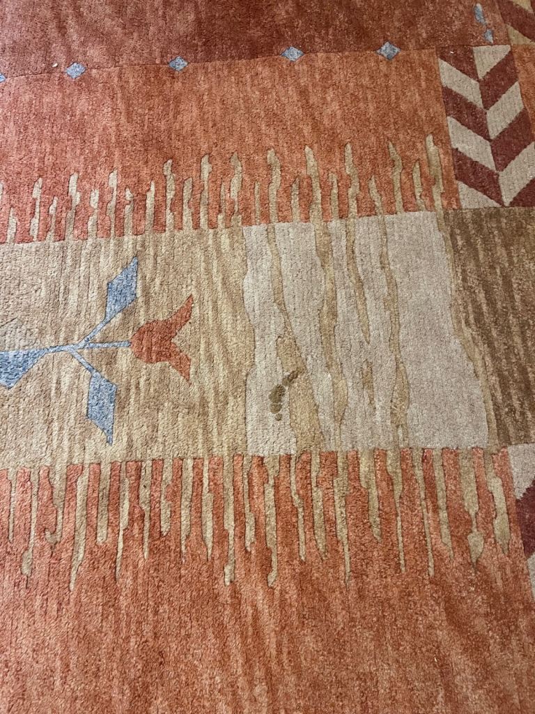 Lovely warm terracotta colours rug Large