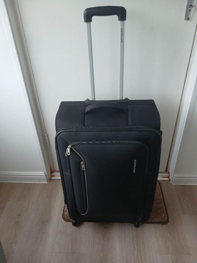 TRAVELLING SUITCASE WITH FOUR WHEELS
