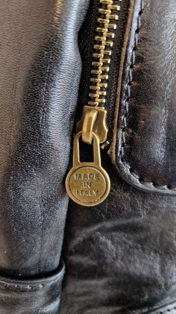 NEW Stylish Italian black zip and clip detail two side pockets leather backpack / laptop bag