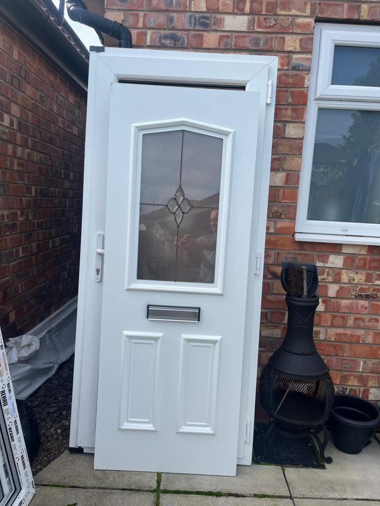 White UPVc door with option of 3 panels 