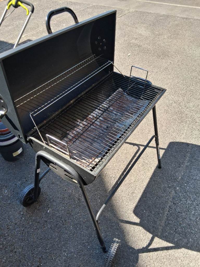 Used Black BBQ Grill with Wheels and Cover