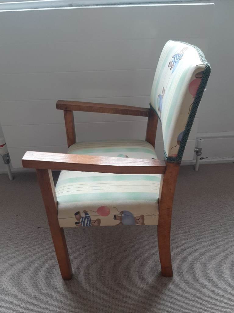 Wooden upholstered armchair