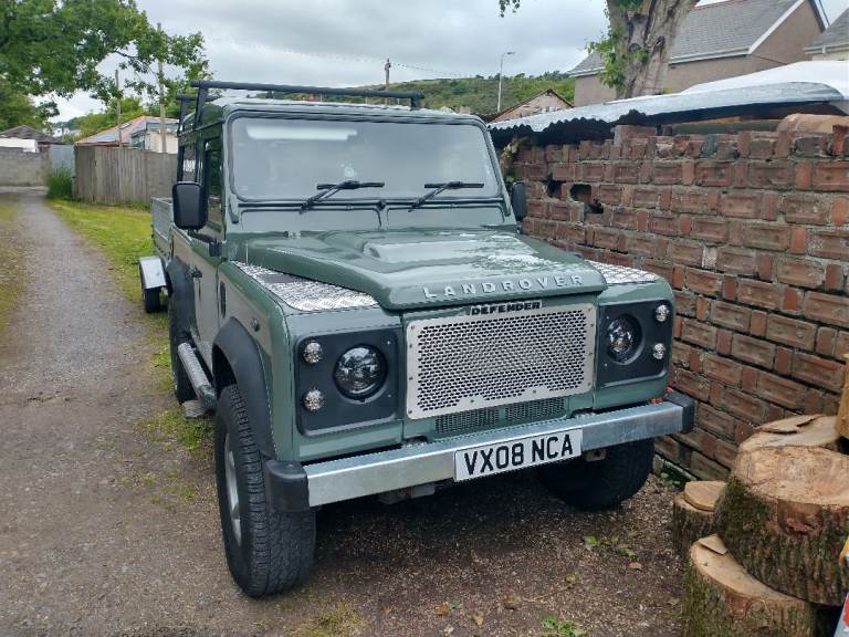 Land Rover Defender with roof tent.