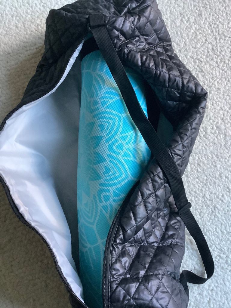 Yoga mat with zipped carry 
