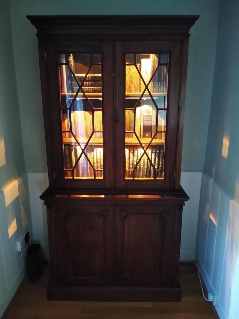 2 Doors Astral Glazed Tall Bookcase and 2 Doors Cupboard.