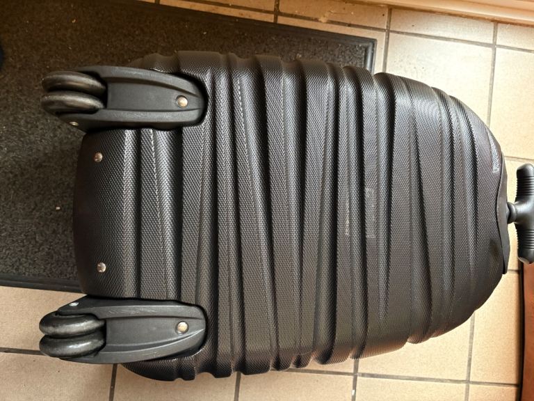 black Lite-Shock 4-Wheel plastic Suitcase with retractable handle