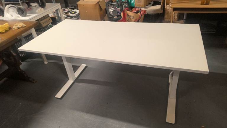 white Ikea table / desk that is height adjustable
