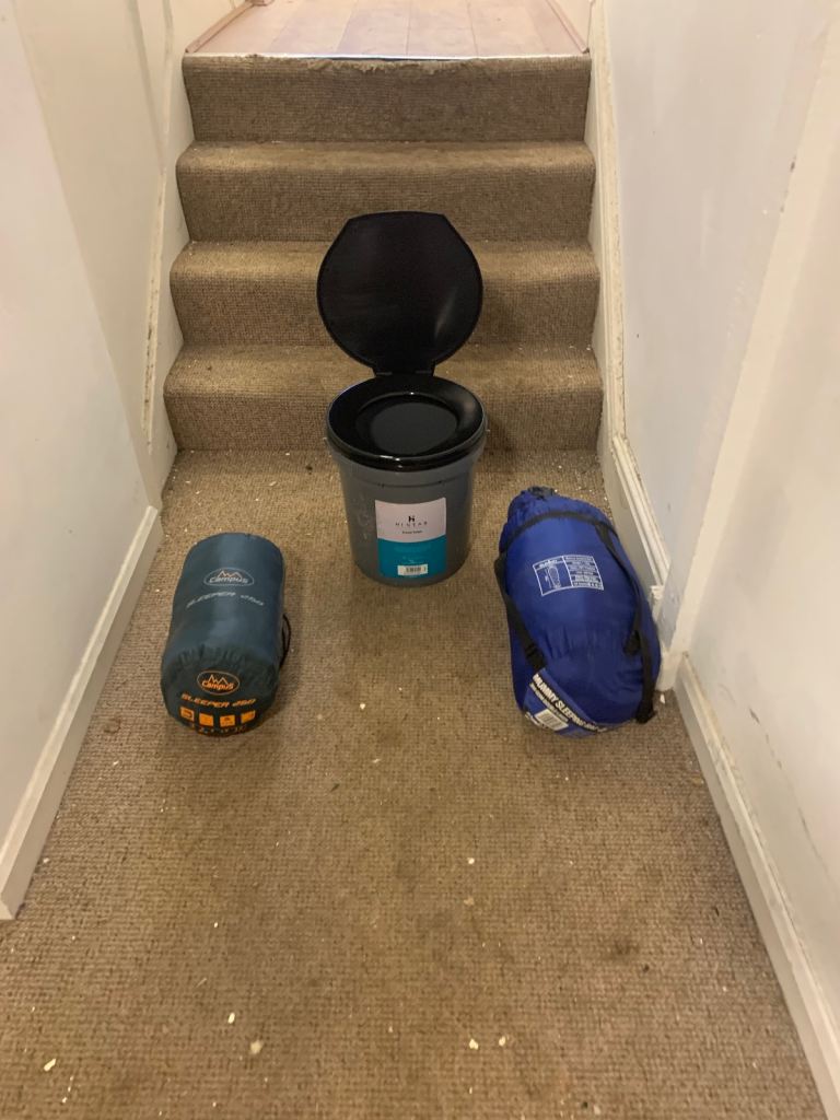 Camping toilet and two sleeping bags