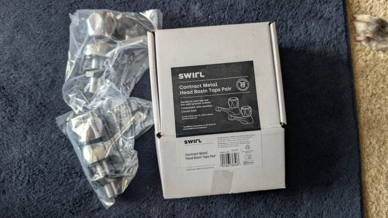 Chrome basin taps and humidity sensing extractor fan