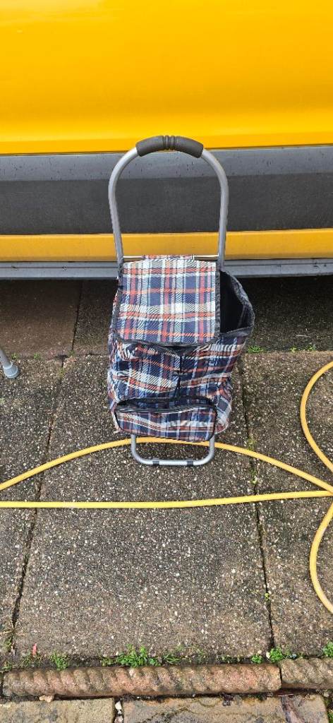 two-wheeled shopping trolley navy check design and a foldable metal frame in £10 cash ws41lb