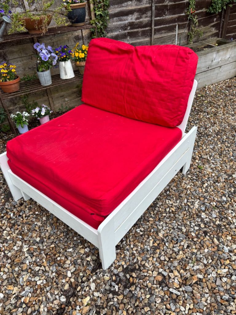 Stompa Children’s white pull out chair bed with red cushions